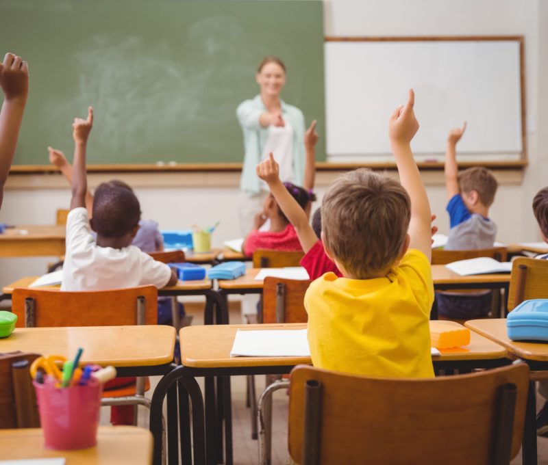 Image of classroom with teacher and young students