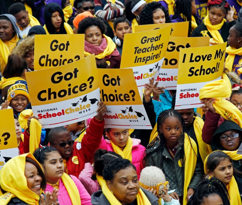 Image of crowd of students with "Got Choice?" signs