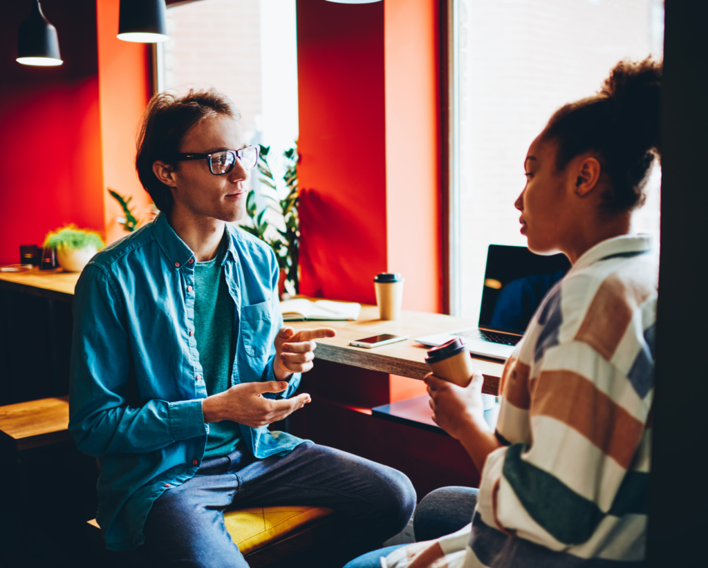 Image of two people talking
